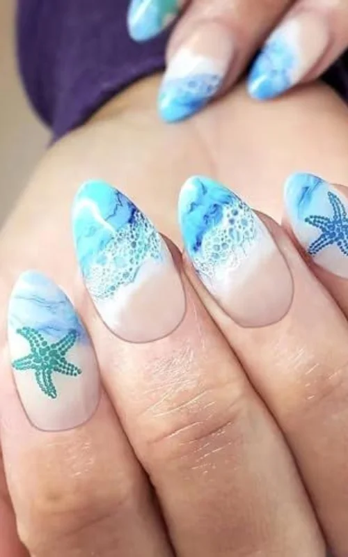 ide design nail art biru muda gaya lautan